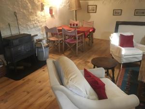 a living room with a couch and a table at Appartement 1 in Montboucher-sur-Jabron