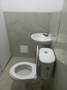 a bathroom with a toilet and a sink at LODGE ELIZABETH HOUSE in San Francisco +13 photos
