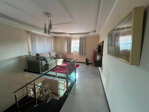 a living room with a couch and a table at Casa 4 quartos in Porto Seguro +9 photos