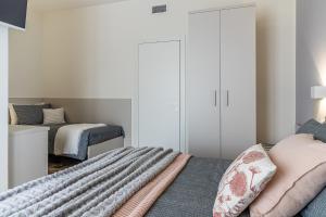 Ένα ή περισσότερα κρεβάτια σε δωμάτιο στο I'M b&b - Zona Aeroporto Internazionale Milano Malpensa