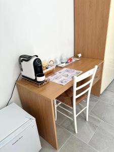 a kitchen with a table with a toaster on it at Garden House in Olbia