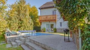a house with a swimming pool in the yard at Vila Familia in Turčianske Teplice