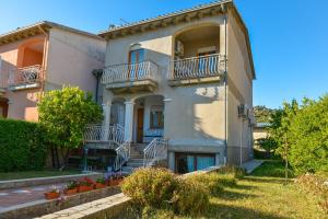 a large building with stairs and balconies on it at La Casa in Gallura primo piano in Calangianus