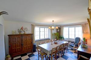 a dining room with a table and chairs at Mas de la Sauvagère in Viviers