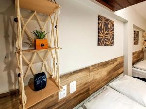 a room with a bed and a shelf at Royal Flat Service 115 - Tambaú (João Pessoa) 115 in Tambaú