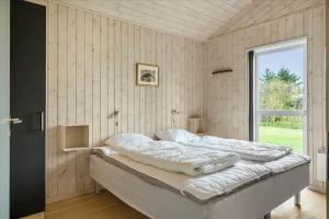 Ένα ή περισσότερα κρεβάτια σε δωμάτιο στο 40769-Ulfborg-Hagevej-16-A