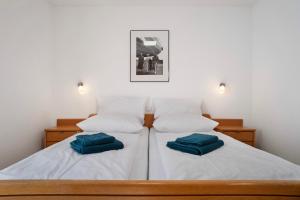 Ένα ή περισσότερα κρεβάτια σε δωμάτιο στο Gästehaus Heinemann - Eg1