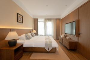 Postel nebo postele na pokoji v ubytování Liao Liao Xin Yuan Boutique Hotel