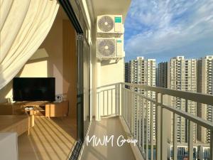 a balcony with a view of a city at Meldrum Heights Muji Creamy House Walks to CIQ in Johor Bahru
