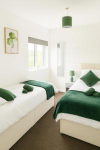 Ένα ή περισσότερα κρεβάτια σε δωμάτιο στο Group & Family Stay ! Central MK +2 φωτογραφίες