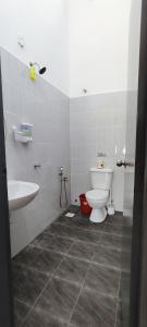 a bathroom with a toilet and a sink at Casa Delora Homestay Jenjarom Banting 