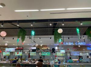 a fast food restaurant with a cash card sign on the ceiling at Everything Within Minutes House in Bangkok