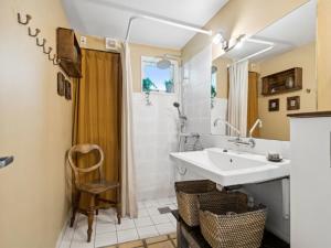 a bathroom with a sink and a shower at Holiday Home Ivar - 150m from the sea by Interhome in Neksø