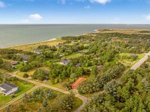 an aerial view of a home next to the ocean at Holiday Home Skrollan - 200m to the fjord by Interhome in Sindrup