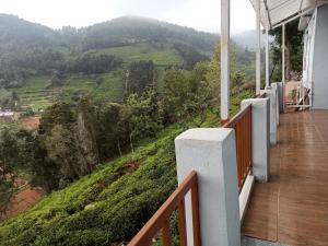 a balcony of a house with a view of a mountain at Ken valley homes & villa in Lovedale +5 photos