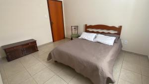 Una cama o camas en una habitación de Iluminarch Home