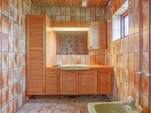 a bathroom with a sink and a mirror and a tub at Holiday Home Natalija - 700m from the sea by Interhome in Ålbæk +18 photos
