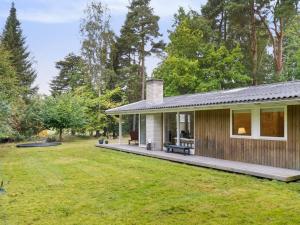 a house with a porch and a yard at Holiday Home Arto - 1-2km from the sea by Interhome in Vig