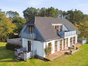 a house with a pitched roof at Holiday Home Elmeri - 200m from the sea by Interhome in Ebeltoft