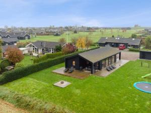an aerial view of a house with a large backyard at Holiday Home Ehmi - 750m from the sea by Interhome in Haderslev