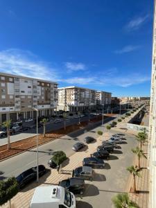 a parking lot with cars parked in a parking lot at Appartement haut standing près de CHU in Oujda