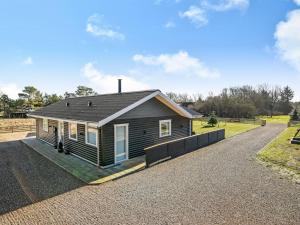 a small house on a gravel road at Holiday Home Elisaveta - 400m to the fjord by Interhome in Vemb
