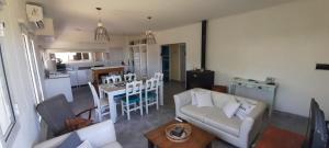 a living room with a couch and a table at Casa Bonita - Balneario RETA - alquiler temporario in Reta