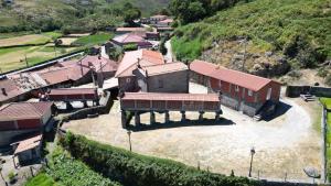an aerial view of a building on a hill at Casa dos Bernardos in Terras de Bouro