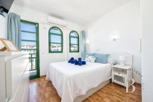 Ένα ή περισσότερα κρεβάτια σε δωμάτιο στο El rinconcito de Armi +14 φωτογραφίες