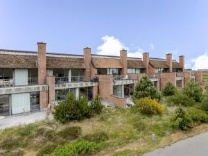 an old brick building with a lot of windows at Apartment Øgoti - 500m from the sea by Interhome in Sønderby +14 photos