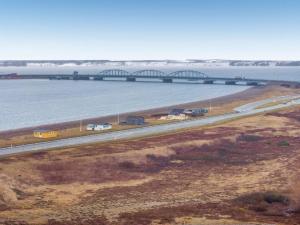 a bridge over a river with cars on a highway at Holiday Home Nyalle - 50m to the inlet by Interhome in Struer