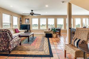 a living room with couches and a table at Copalis Beach Family Home Close to Sites and Nature in Copalis Beach