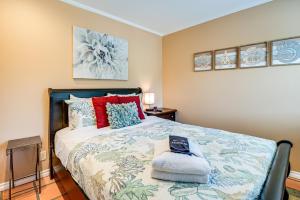 a bedroom with a bed with a blue and white bedspread at Copalis Beach Family Home Close to Sites and Nature in Copalis Beach