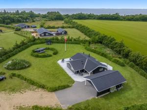 an overhead view of a house on a green field at Holiday Home Antero - 500m to the fjord by Interhome in Spottrup +33 photos