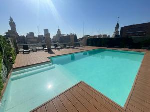 a large swimming pool on top of a building at Ayres Suites Moreno in Buenos Aires