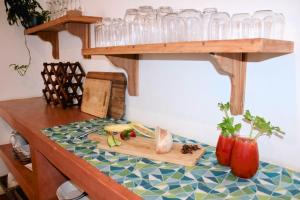 a table with glasses and vegetables on a table at Woodlands Beach Villa in Southbroom