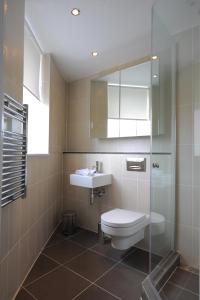 A bathroom at TheHeart Apartments by BridgeStreet 