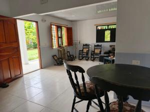 a dining room and living room with a table and chairs at Casa S&J in Mompos
