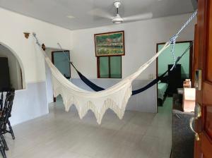 a hammock in the middle of a room at Casa S&J in Mompos