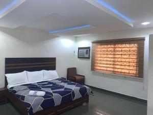 Ένα ή περισσότερα κρεβάτια σε δωμάτιο στο Potomac Hotel managed by Milord hospitality