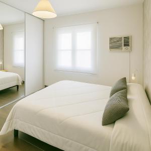 En eller flere senge i et værelse på Atenea Residence