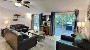 a living room with a couch and a table at Put-in-Bay Island Club #97 in Put-in-Bay