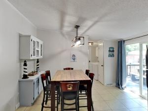 a kitchen and dining room with a table and chairs at Put-in-Bay Island Club #97 in Put-in-Bay +22 photos