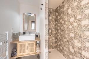 a bathroom with a sink and a mirror at La grange in Sacy-le-Petit +25 photos