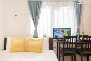 Uma TV ou centro de entretenimento em KYARA Hotel 亀戸402