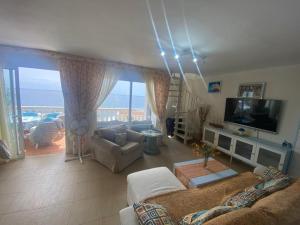 TV/trung tâm giải trí tại Roca Negra Playa Paraíso Apartment 2-bedrooms