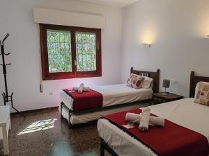 En eller flere senge i et værelse på Villa Montilla