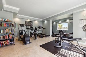 a gym with several treadmills and elliptical machines at Michelina 406 in Cape Canaveral