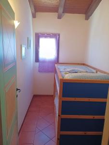 Postel nebo postele na pokoji v ubytování Rifugio Del Sognatore Stintino