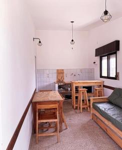 a living room with a couch and a table at Casa Chapadmalal in Colonia Chapadmalal